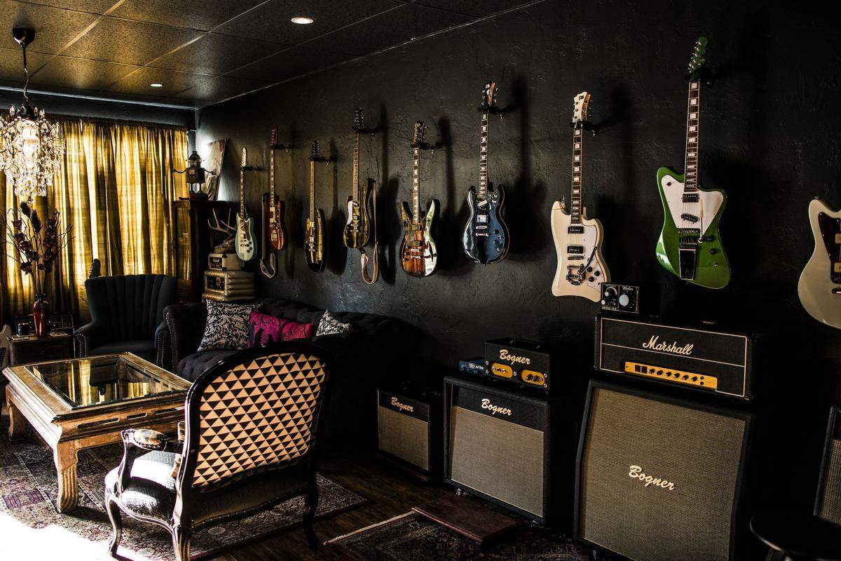 The showroom of PureSalem Guitars includes couches and a record player. Photograph by Felipe Cuevas.