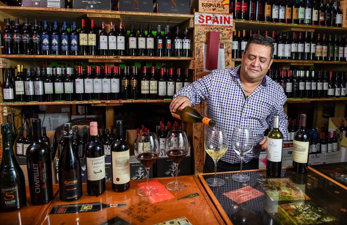 JC Restrepo pours a glass at Happy Wine in Miami. Photograph by Carina Mask.