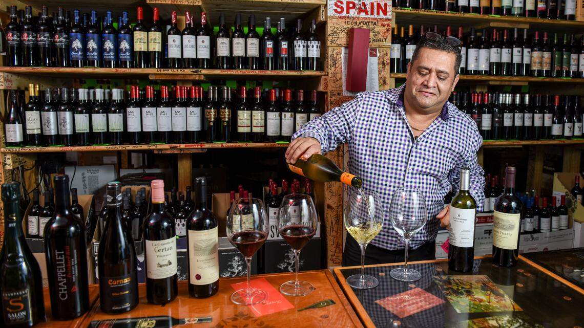 J.C. Restrepo pours a glass at Happy Wine in Miami.