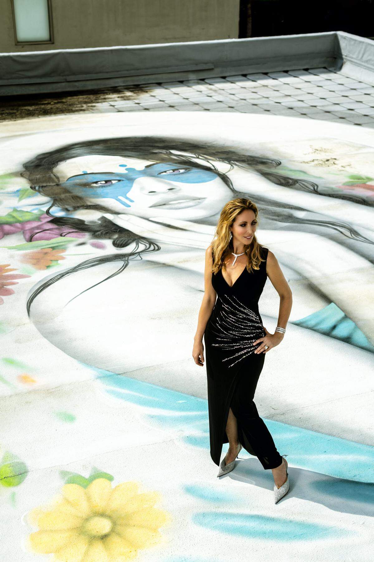 Dress by Balmain and shoes by Balenciaga from Neiman Marcus at Merrick Park, “Serpenti” necklace, earrings and bracelet by Bulgari at Miami Design District. Artwork: Fin DAC. Photograph by Nick Garcia. Styling by Elysze Held.