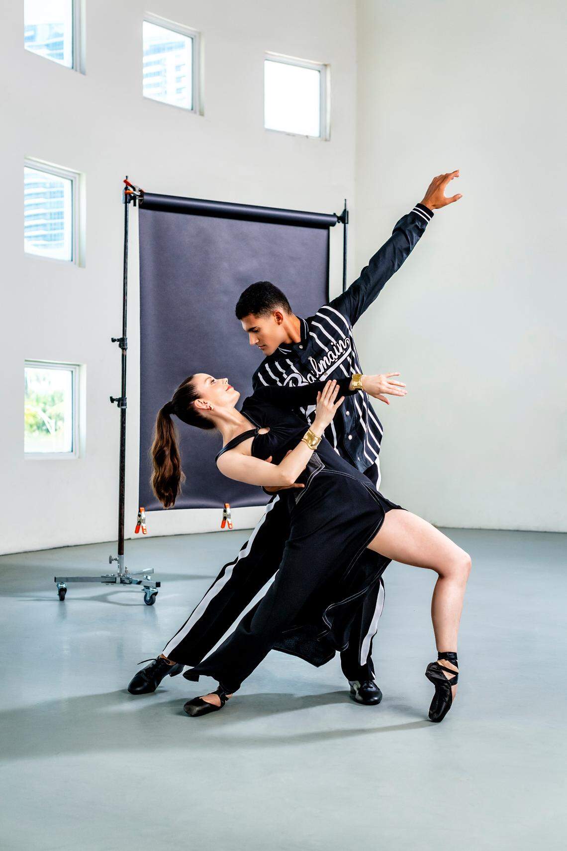 On Jennifer: Dress by Yigal Azrouël (yigal-azrouel.com); jewelry by Tiffany &amp; Co. (tiffany.com). On Renan: Shirt by Balmain, pants by Versace from Saks Fifth Avenue at Bal Harbour Shops. Photograph by Nick Garcia.