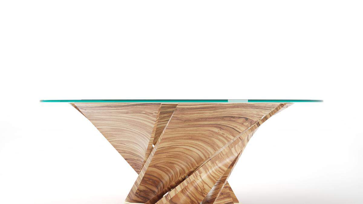 The Torsion table by Natuzzi was designed by Mario Bellini.