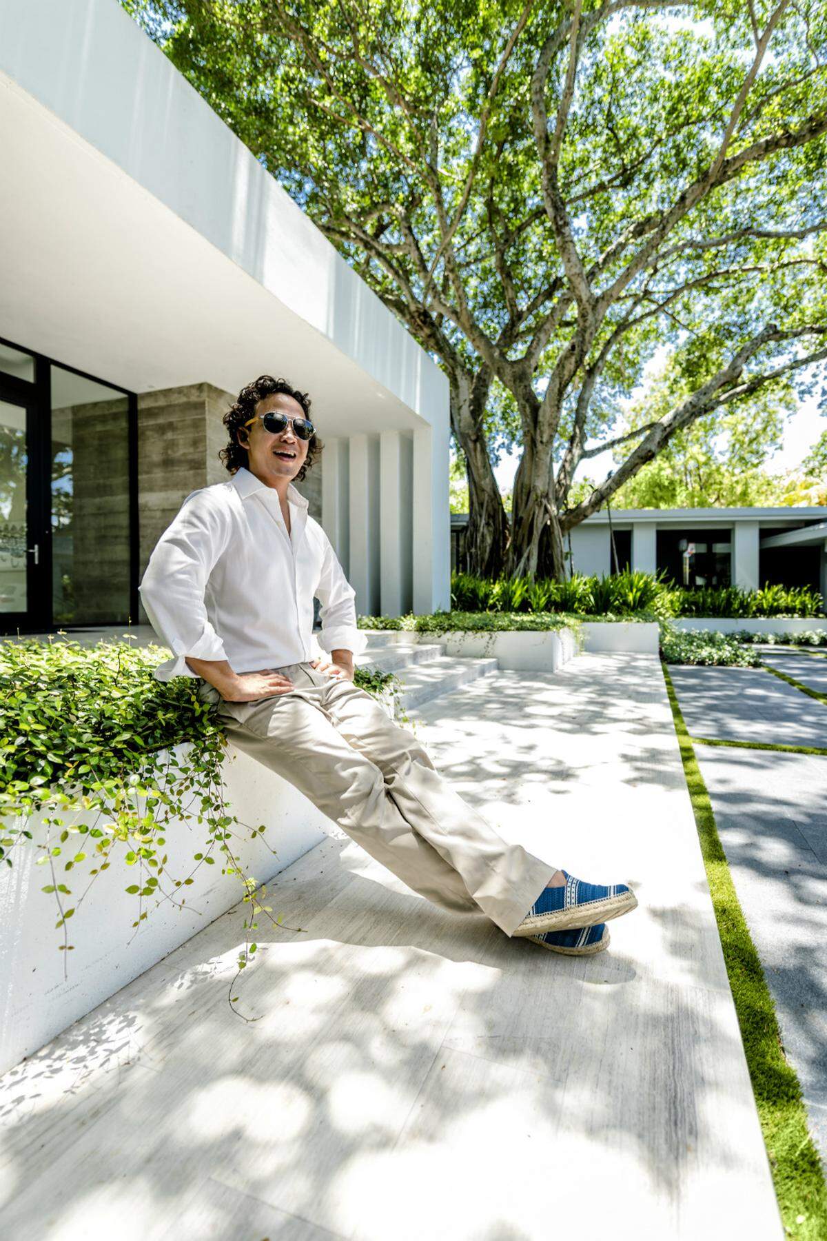 Fernando Wong at a private residence in Miami Beach where he designed the landscaping. Photograph by Nick Garcia for INDULGE.