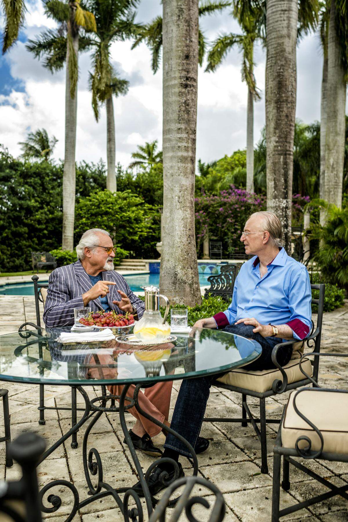 Stuart Grossman and Roy Black catch up in the backyard of Black's home. Photograph by Nick Garcia.