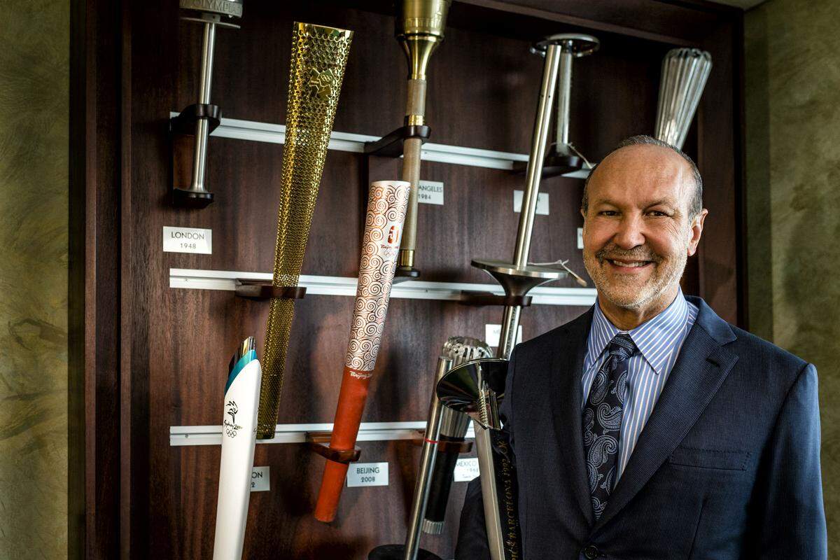 Ron Book, pictured at his Hollywood office with part of his extensive collection of Olympic torches, in 2019.