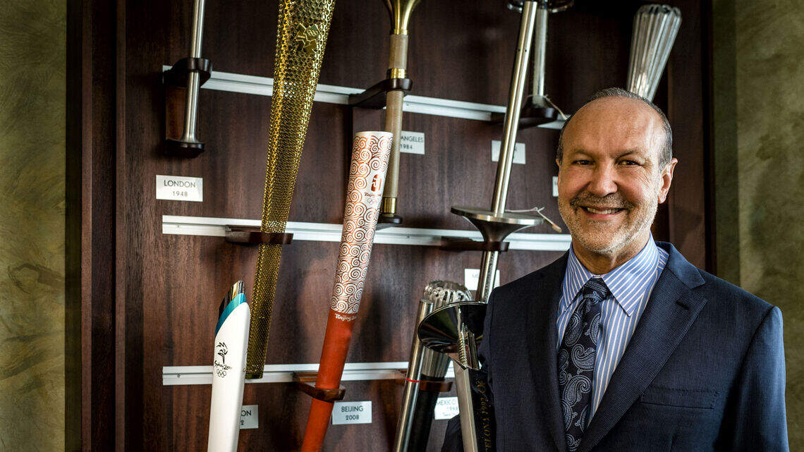 Ron Book’s collection of Olympic torches keeps his competitive spirit burning