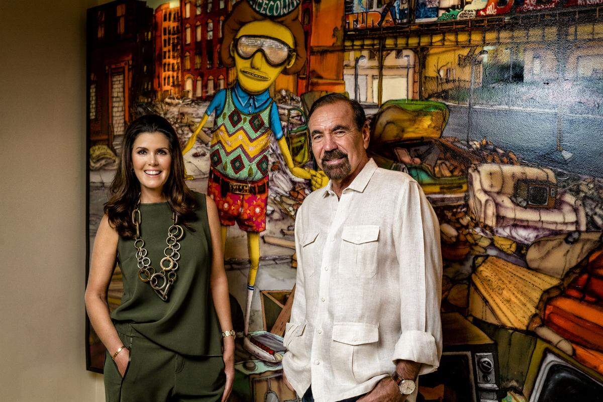 A city portrait titled 'South Bronx,' by Brazilian twins Otavio and Gustavo Pandolfo (Os Gemeos), greets guests in the entranceway of Darlene and Jorge Pérez's home.  Photograph by Nick Garcia.