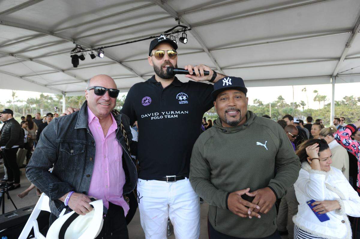 Beach Polo World Cup founder Tito Gaudenzi, center, with Shark Tank stars Kevin O'Leary, left, and Daymond John. Photograph by Seth Browarnik / World Red Eye.