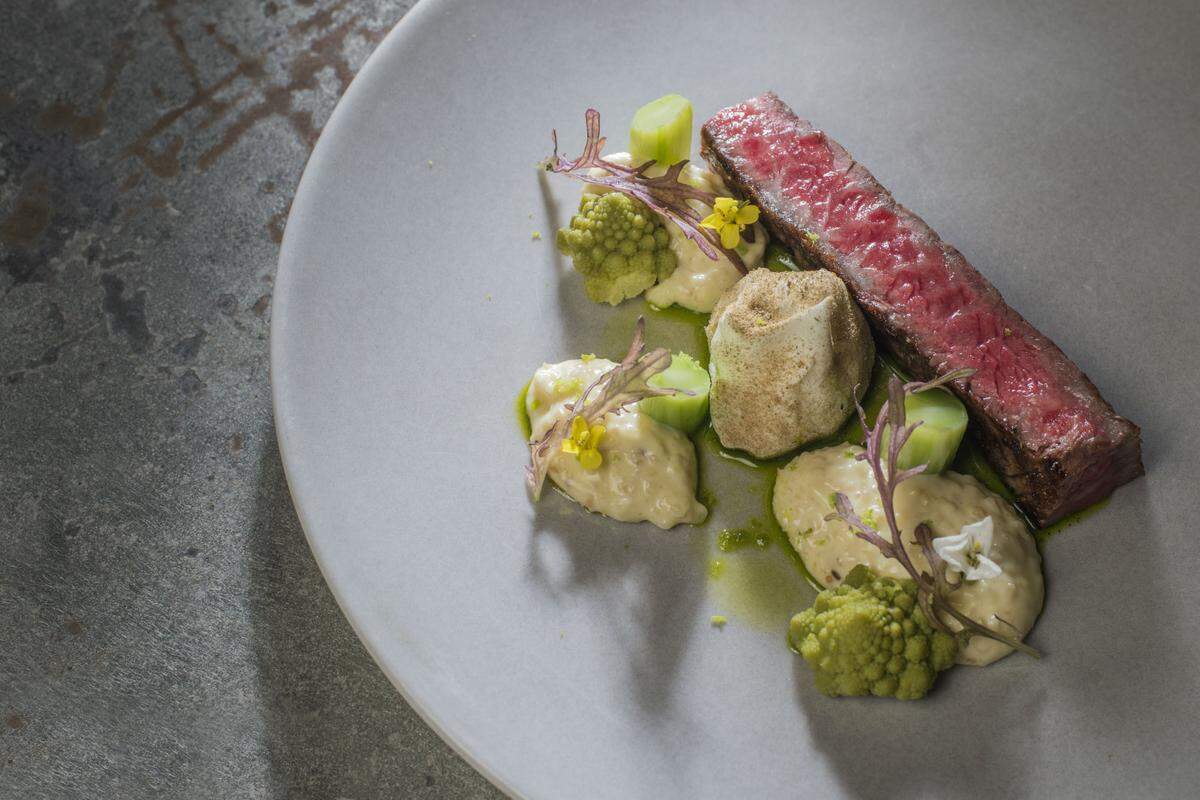 Wagyu striploin with grits and brassica vegetables, from chef Brad Kilgore of Alter restaurant in Wynwood. Photograph by Felipe Cuevas.