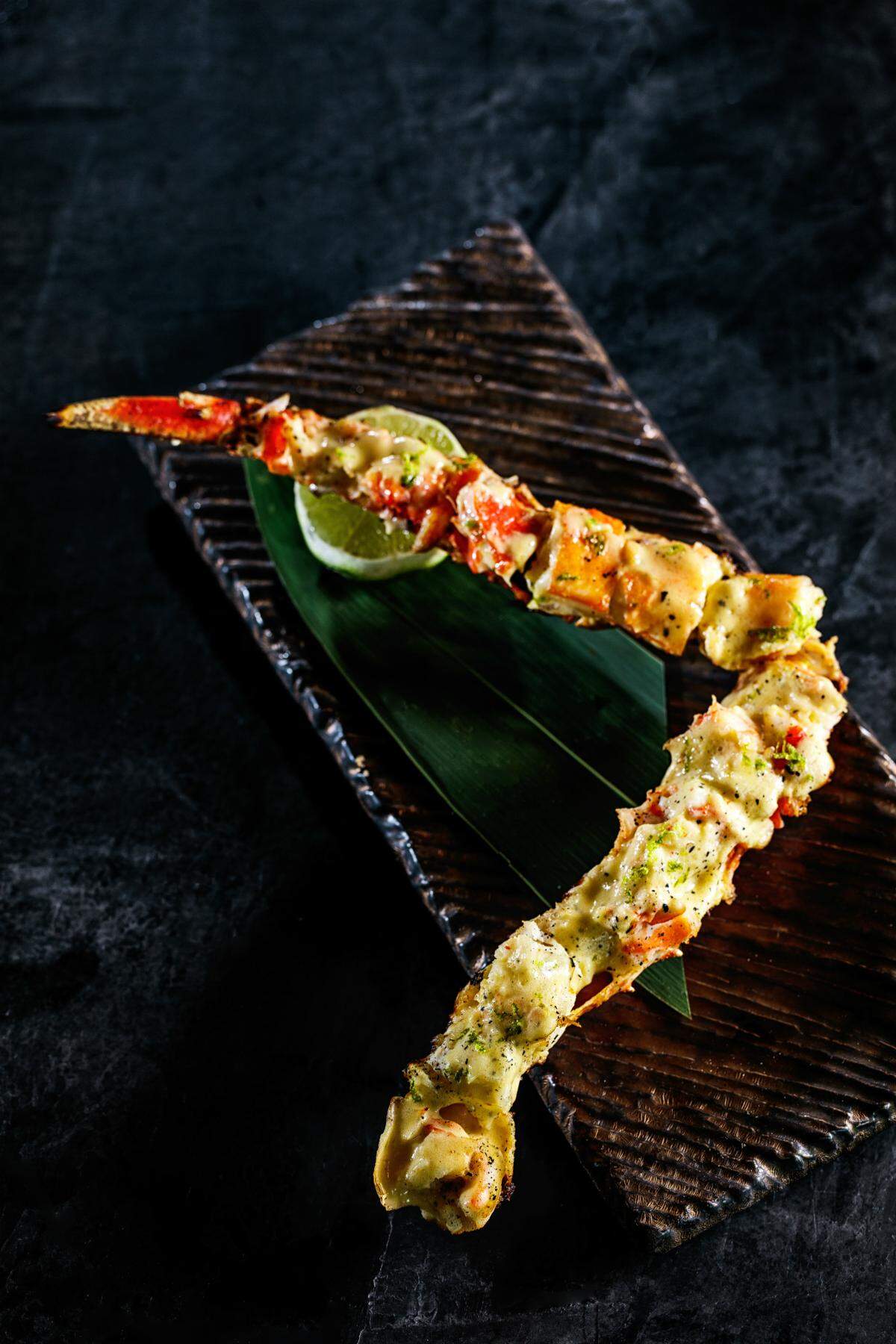 King crab is basted with truffle butter at Novikov. Photograph by Libby Volgyes.