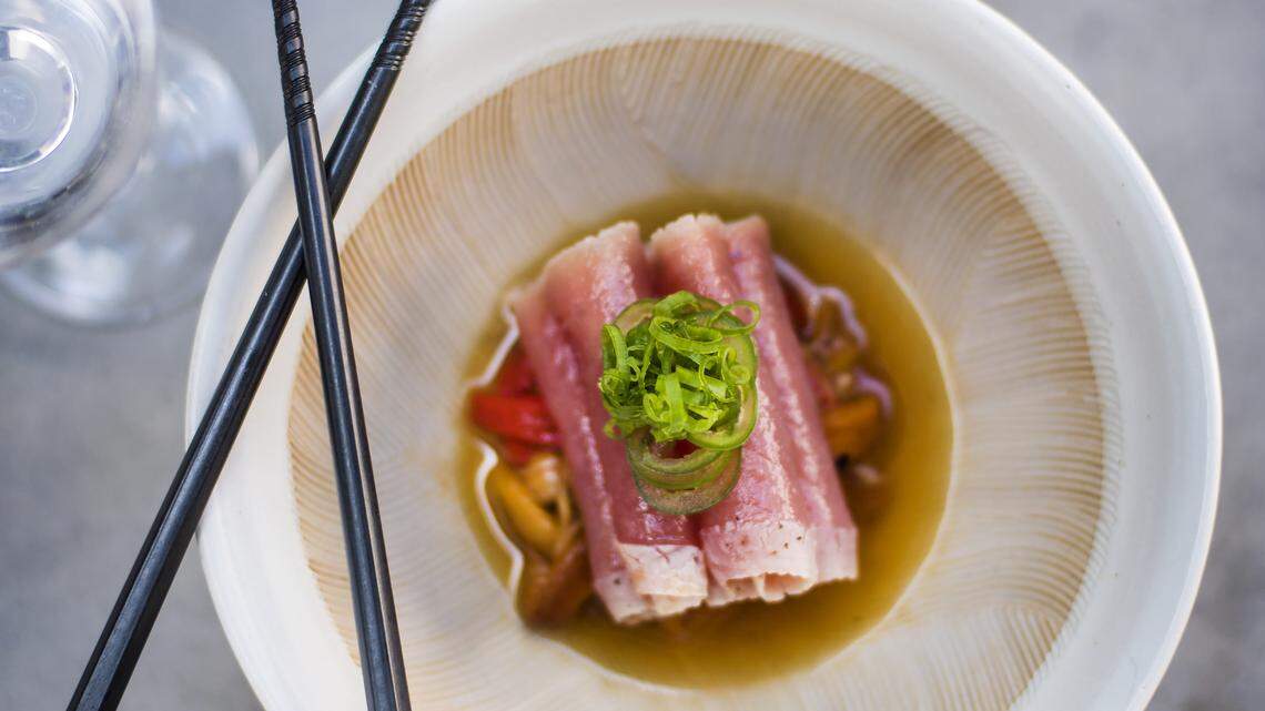 Tuna Tataki at KYU in Wynwood starts with high-quality tuna loin seared and served over a pool of peppers and ponzu sauce. Photograph by Felipe Cuevas.