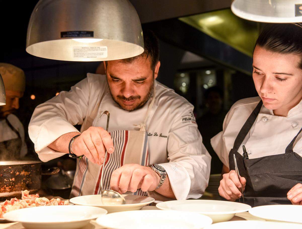 Chef Felix Lo Basso prepares a dish at Valentino Cucina Italiana in Fort Lauderdale. Photograph by Carina Mask.
