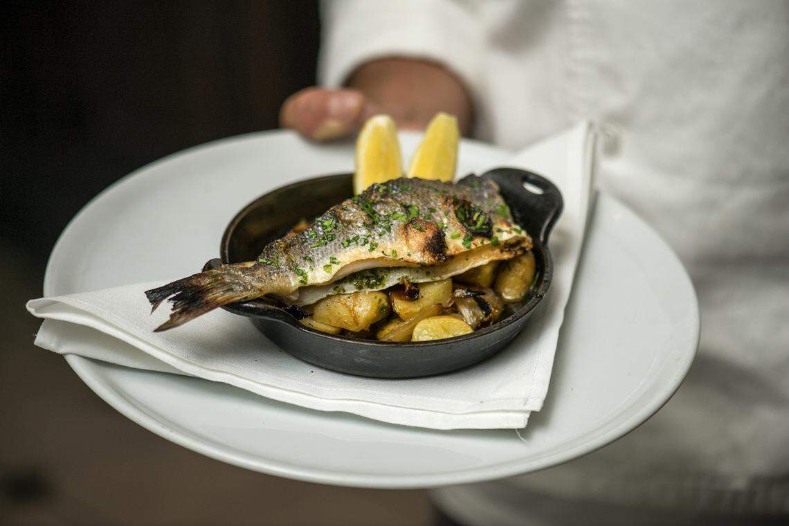 Two Chefs' special wood-roasted whole fish. Photograph by Felipe Cuevas for INDULGE.