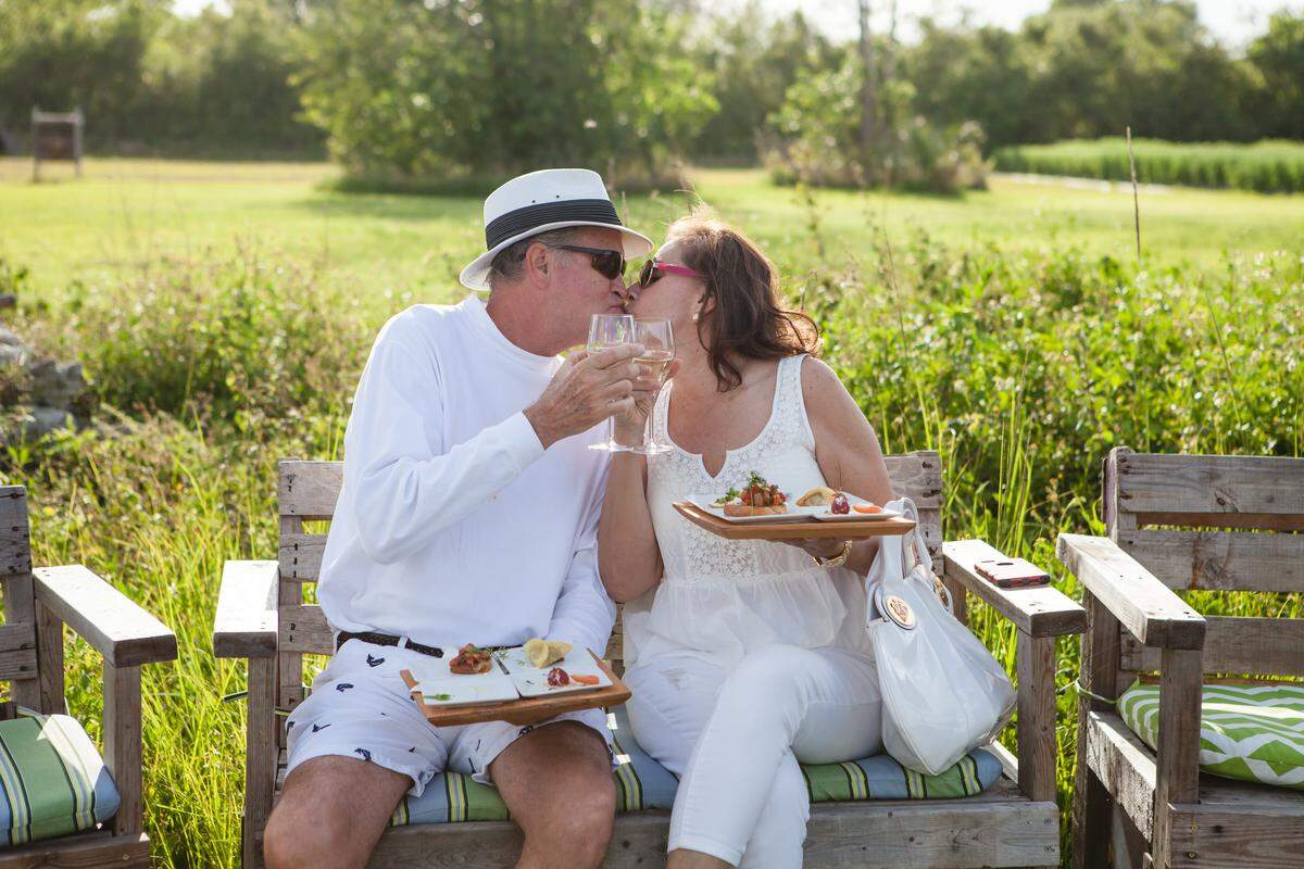 A farm-to-table smooch. Photograph by Papp Photo.