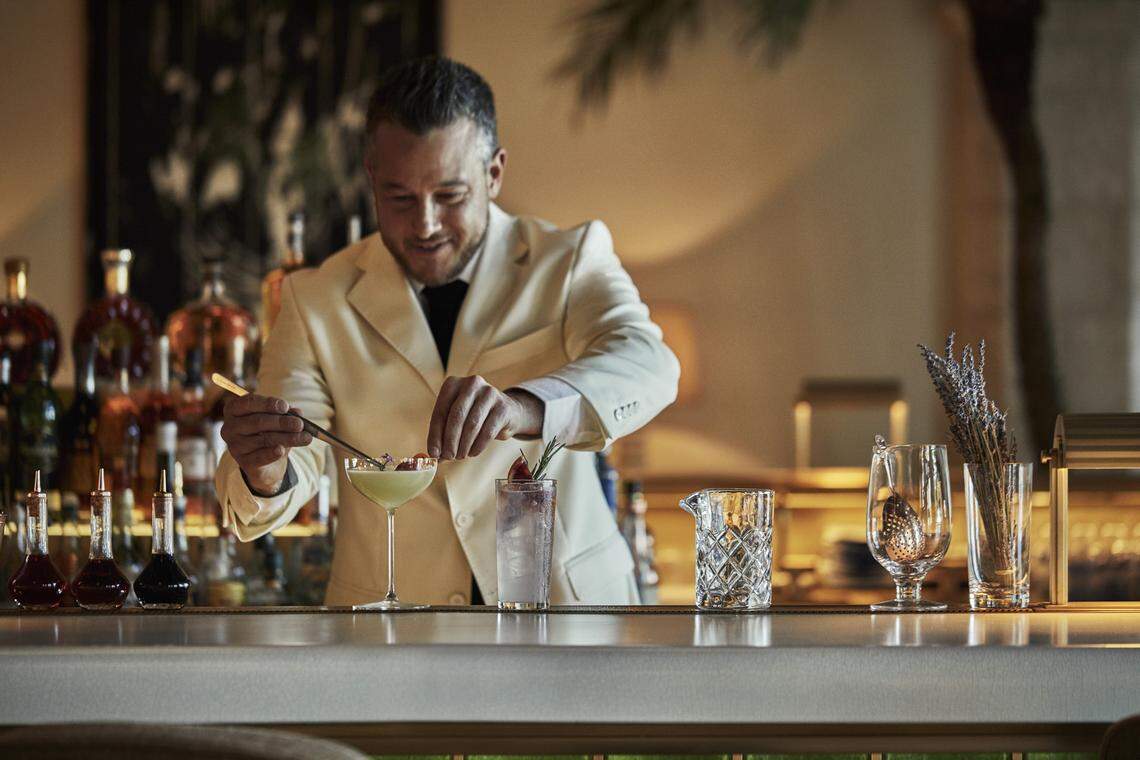 Fixing a cocktail at the Champagne Bar outside Le Sirenuse.