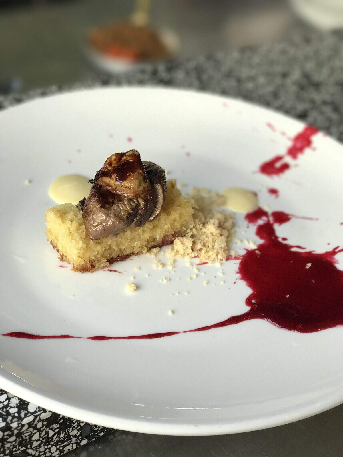 Foie gras on semolina honey cake with wild berry coulis was on a recent tasting menu at Machneyuda restaurant in Jerusalem. Photograph by Evan S. Benn.