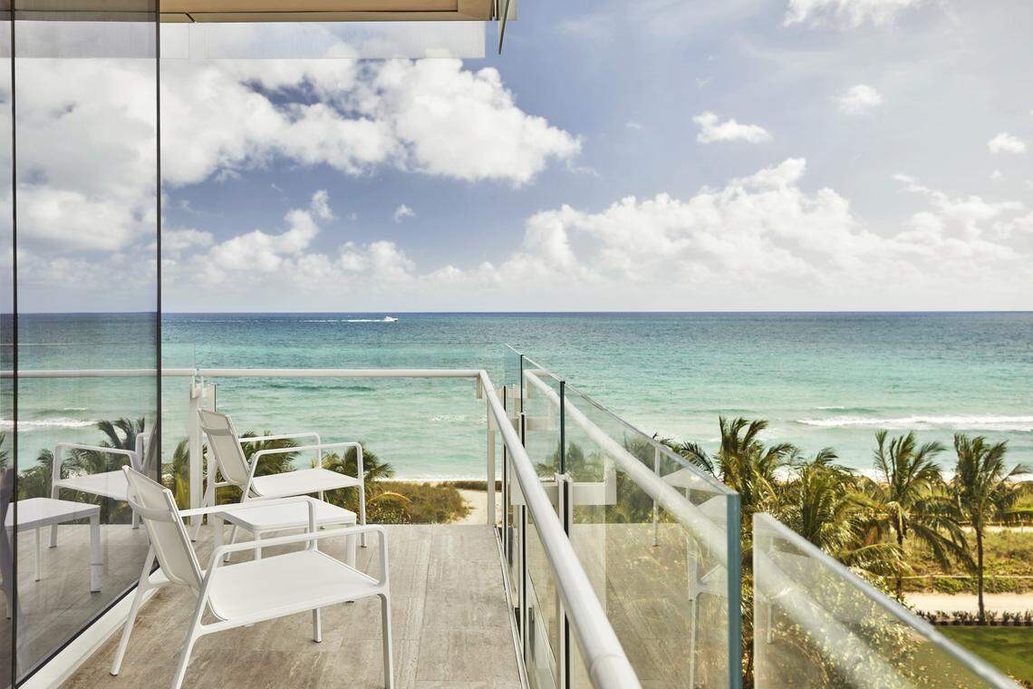 A guest room's wraparound balcony offers views of the ocean and downtown.
