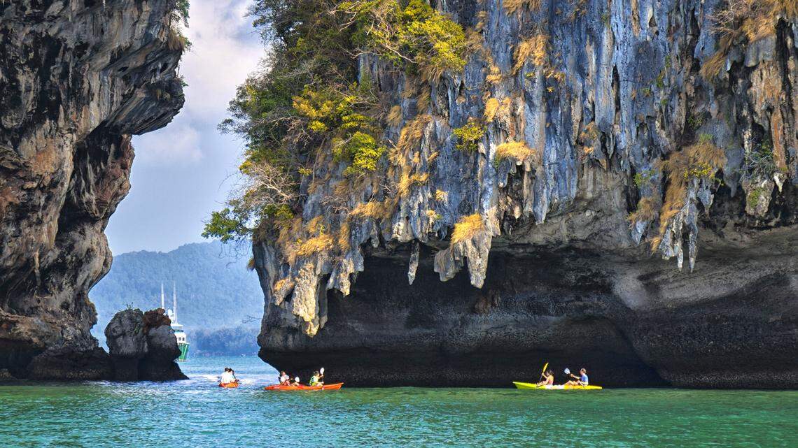 Railay Beach in Krabi, Thailand, is a top destination for relaxing water activities and breathtaking beauty.