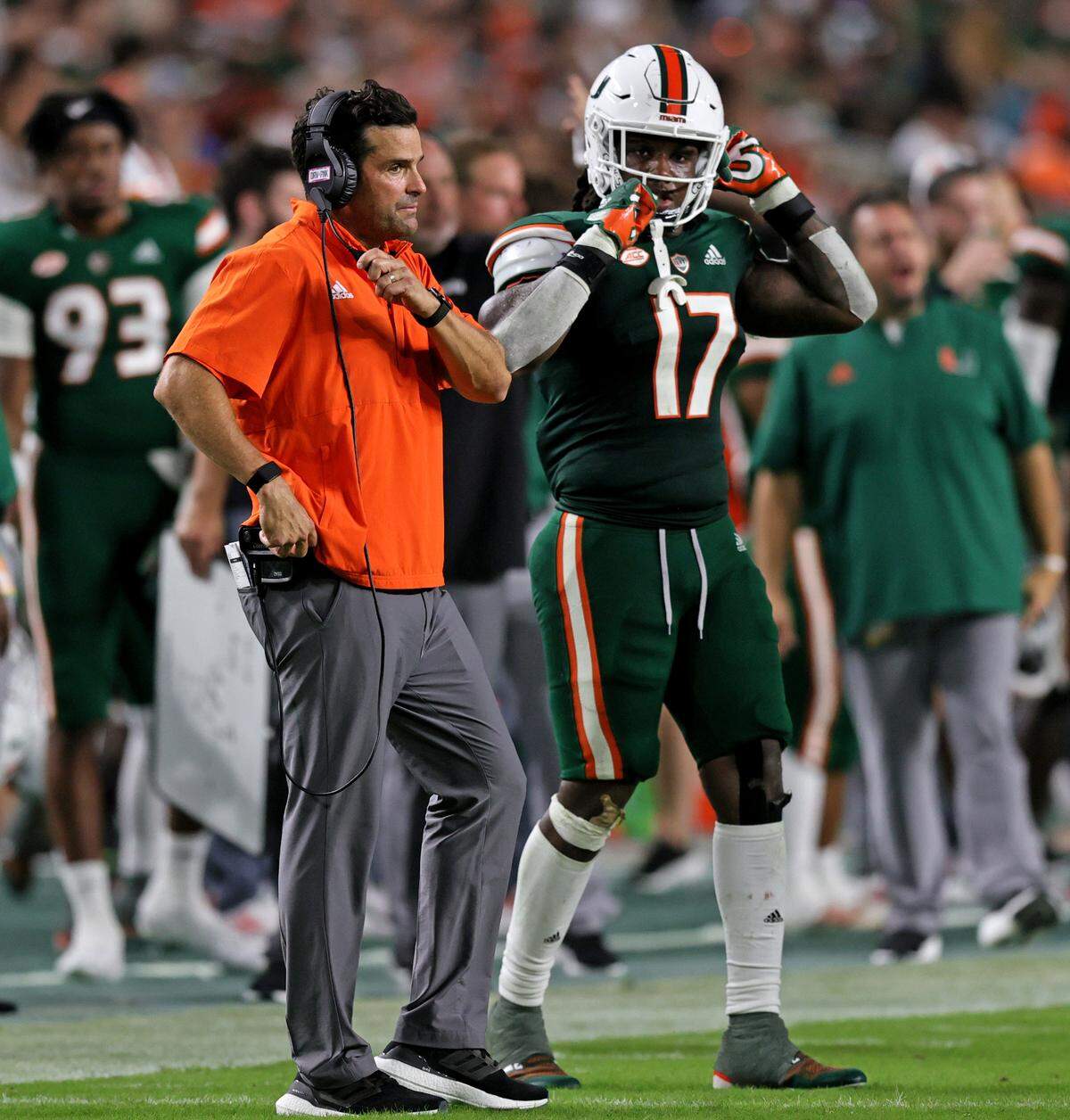 Miami Hurricanes head coach Manny Diaz and Hurricanes linebacker Waynmon Steed (17) look from the sidelines during the third quarter of their ACC football game against the Appalachian State Mountaineers at Hard Rock Stadium on Saturday, September 11, 2021 in Miami Gardens, Florida.