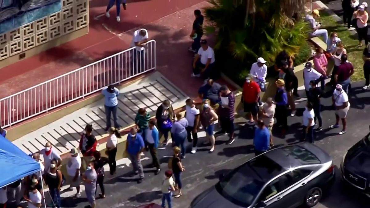 Hundreds of people put themselves at risk of being infected with the coronavirus to get an application for unemployment benefits in Hialeah.