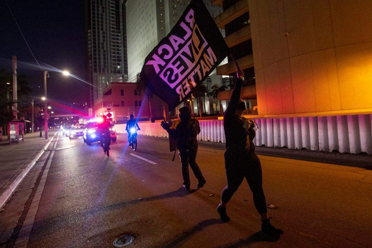 Protestors hold up traffic on NE Miami Avenue during a protest by South Florida activists, to get justice for Ma’khia Bryant, who was killed by police in Columbus, Ohio, at the Simon Bolivar Monument in Downtown Miami, Florida, on Saturday, April 24, 2021.