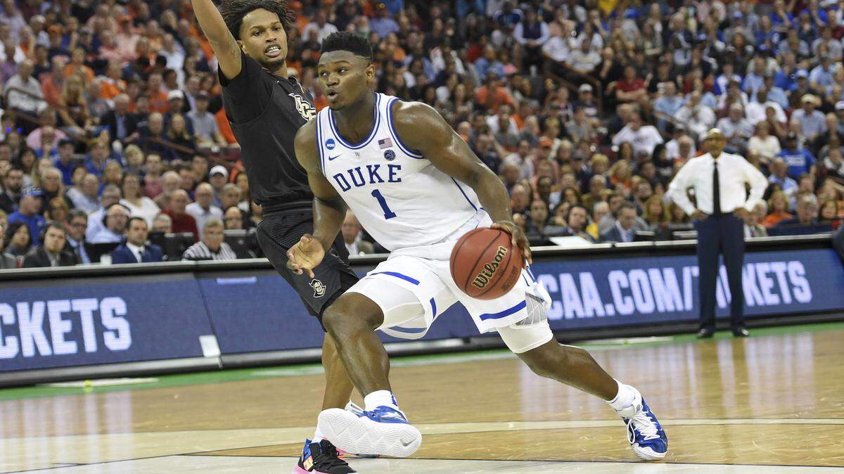 Duke’s Zion Williamson (1) drives against Central Florida’s Terrell Allen to shoot a layup during the first half of a first round men’s college basketball game in the NCAA Tournament in Columbia, S.C. Sunday, March 24, 2019.