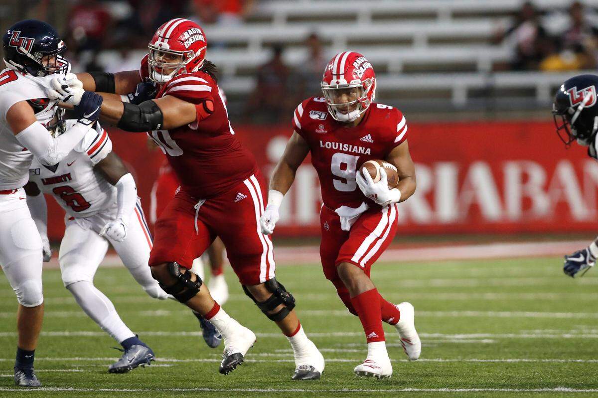 Louisiana Lafayette running back Trey Ragas (9) and offensive lineman Robert Hunt (50) during an NCAA college football game against Liberty, Saturday, September 7, 2019, in Lafayette, La. (AP Photo/Tyler Kaufman)