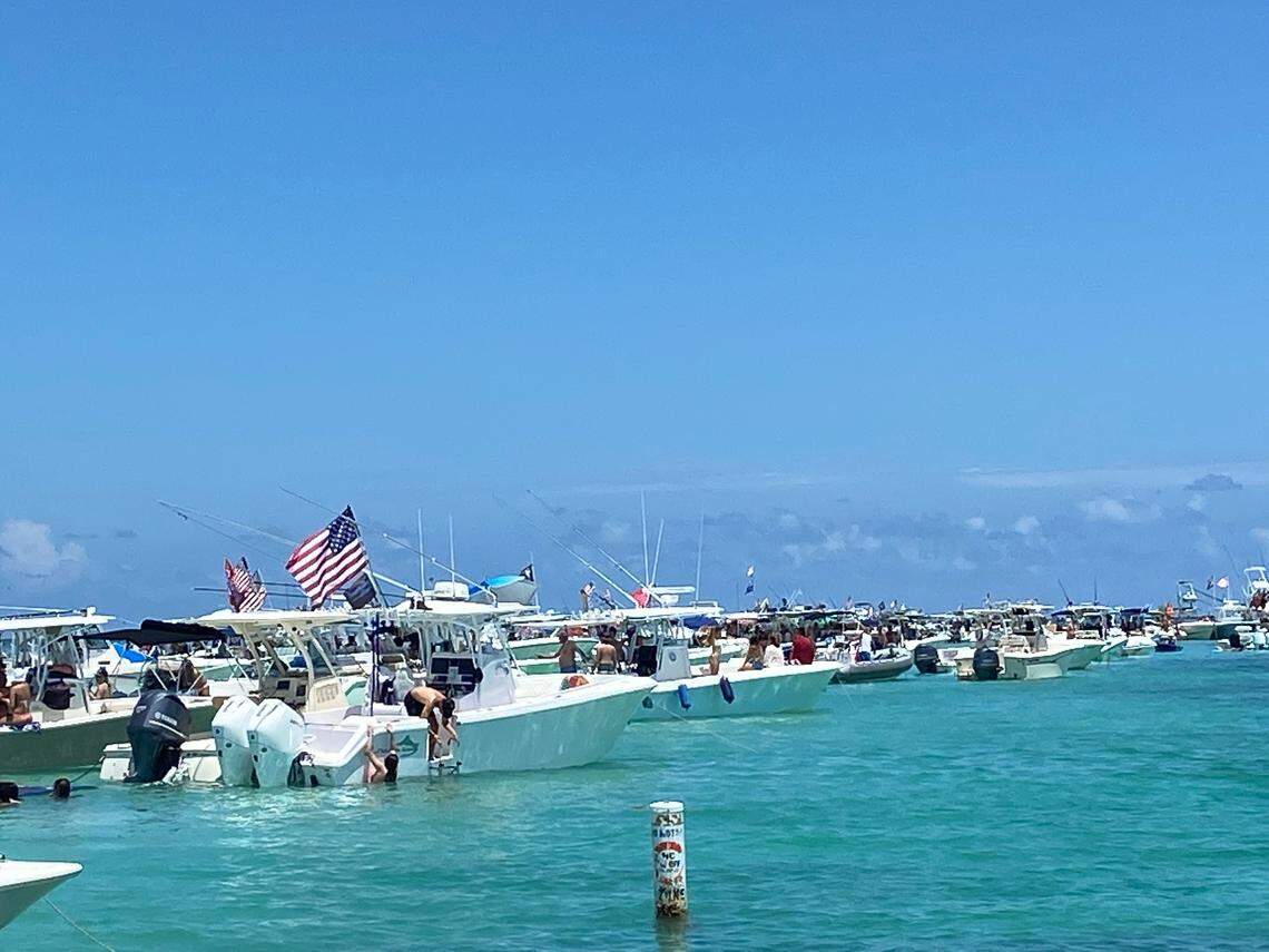 Dozens of boats anchor on the sandbar off Windley Key in the Florida Keys Sunday, May 30, 2021.