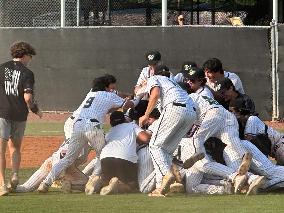 Westminster Christian baseball players pile on each other after the final out of their 9-4 win over Fort Lauderdale Calvary Christian in the Region 4-3A final on Tuesday at Westminster.