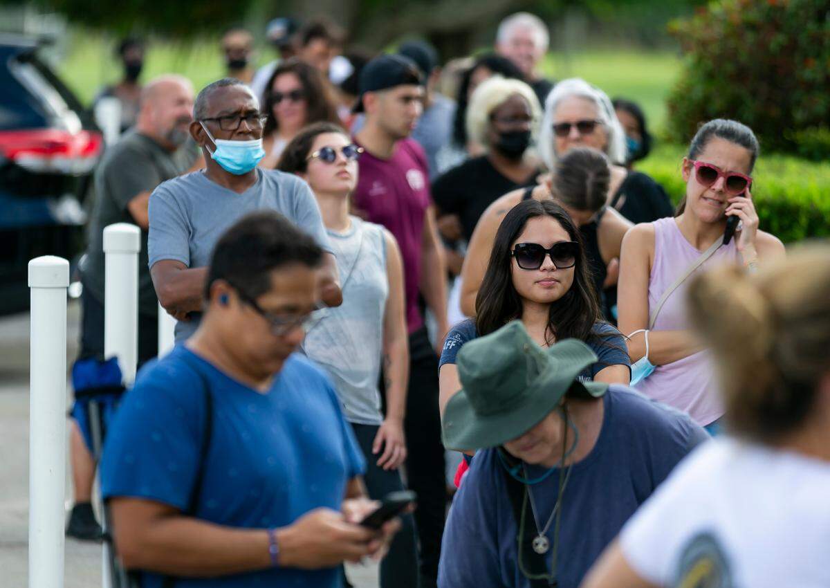 Cinnamon roll lovers wait in line at Knaus Berry Farm in Homestead on opening day in 2021.