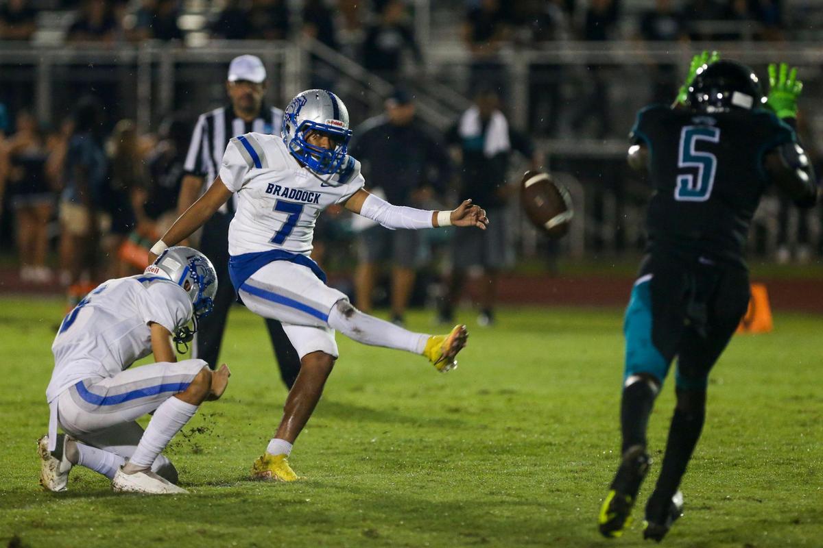 Braddock kicker Christian Lopez (7) kicks an extra point conversion during the first half of a high school football game against Coral Reef at Southridge Park in Miami, Florida, Thursday, September 15, 2022.