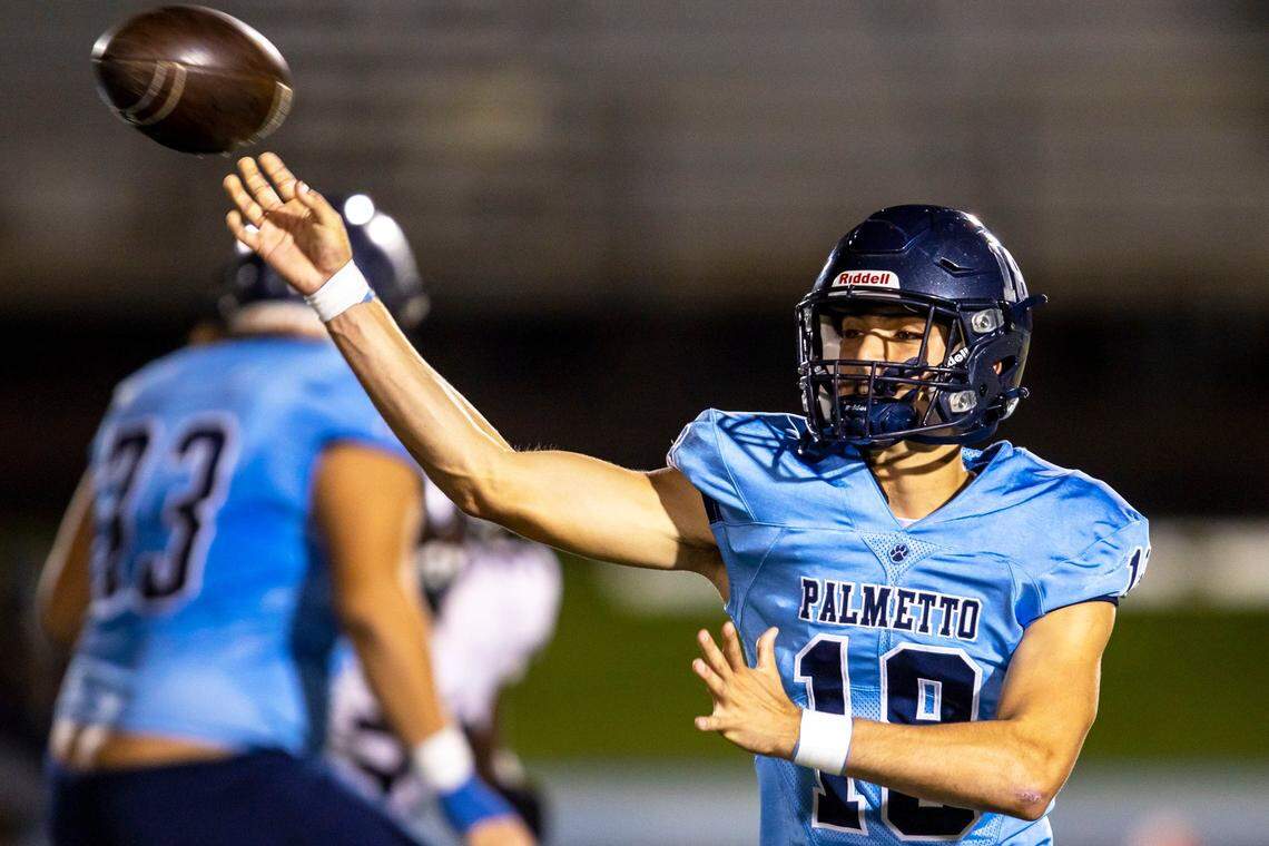 Miami Palmetto back-up quarterback Lucas Suarez (18) throws the ball (23) during the second half of a high school football game against Miami Norland at Tropical Park in Miami, Florida, on Thursday, October 20, 2022.