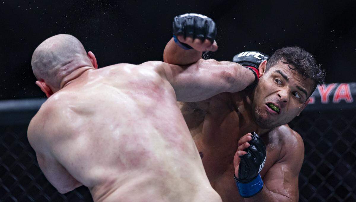 Azamat Murzakanov of Russia and Paulo Costa of Brazil fight in their light heavyweight bout at UFC 327 at the Kaseya Center on Saturday, April 11, 2026, in downtown Miami, Fla.
