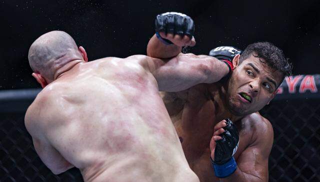 Azamat Murzakanov of Russia and Paulo Costa of Brazil fight in their light heavyweight bout at UFC 327 at the Kaseya Center on Saturday, April 11, 2026, in downtown Miami, Fla.