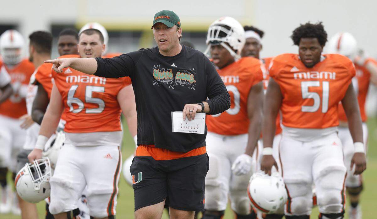 Miami Hurricanes offensive line coach, Garin Justice works with players during practice drills at the University of Miami’s Greentree Field in Coral Gables on Friday, March 6, 2020.