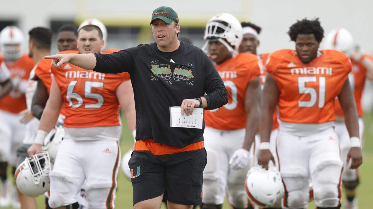 Miami Hurricanes offensive line coach, Garin Justice works with players during practice drills at the University of Miami’s Greentree Field in Coral Gables on Friday, March 6, 2020.