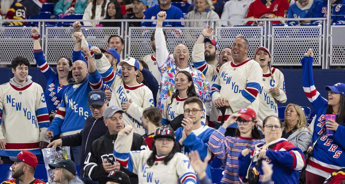 New York Rangers fans cheer after their team scored against the Florida Panthers in the third period of their Winter Classic outdoor hockey game at loanDepot park on Friday, Jan. 2, 2026, in Miami, Fla.