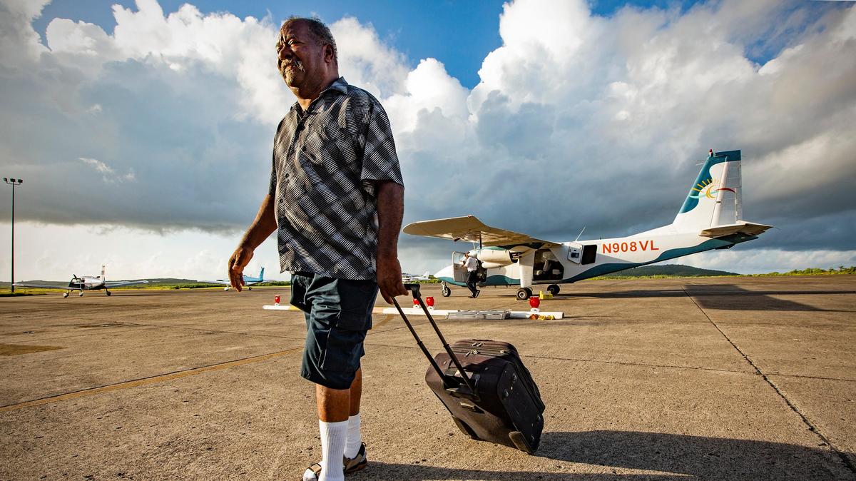 Radames Cabral, 65, arrives at José Aponte de la Torre Airport that serves Ceiba, a coastal town in Puerto Rico, on Aug. 15, 2018. Trinidad travels to the Fresenius Kidney Care dialysis center in Humacao three times a week for treatment that takes all day.