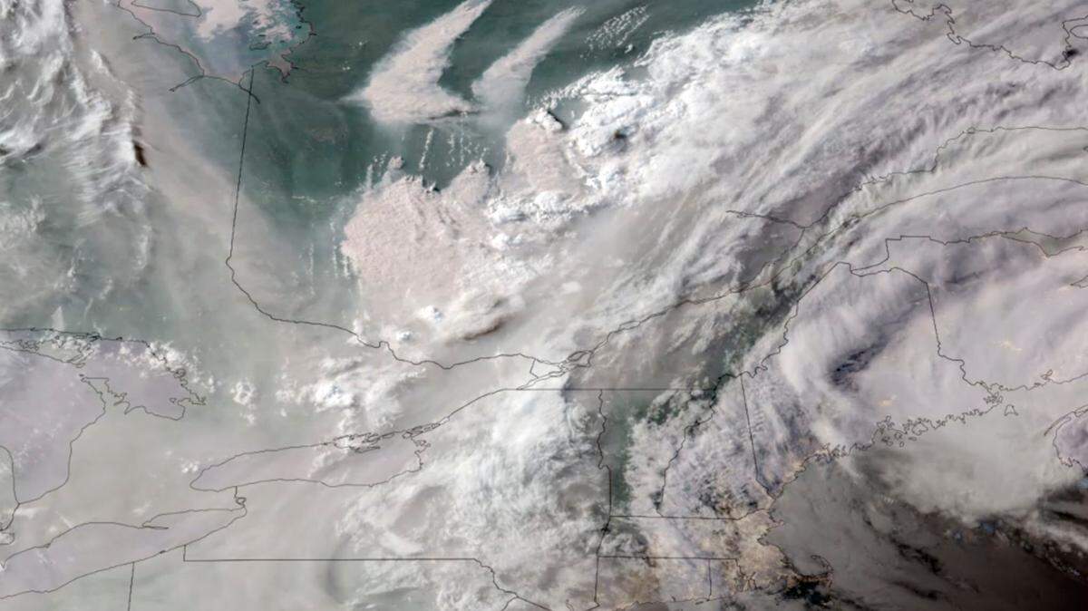 Over 150 wildfires rage in Quebec, an “unprecedented” number, sending smoke across parts of the U.S. and harming air quality, photos show.