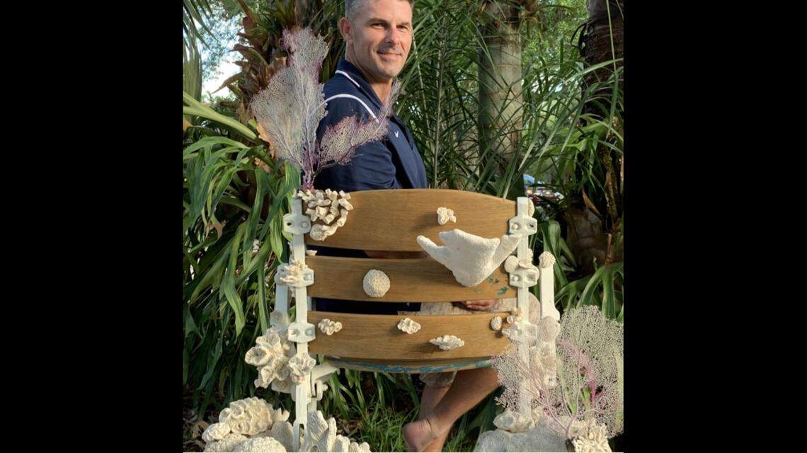 Rush Bowles with the seat he created from the Miami Marine Stadium.