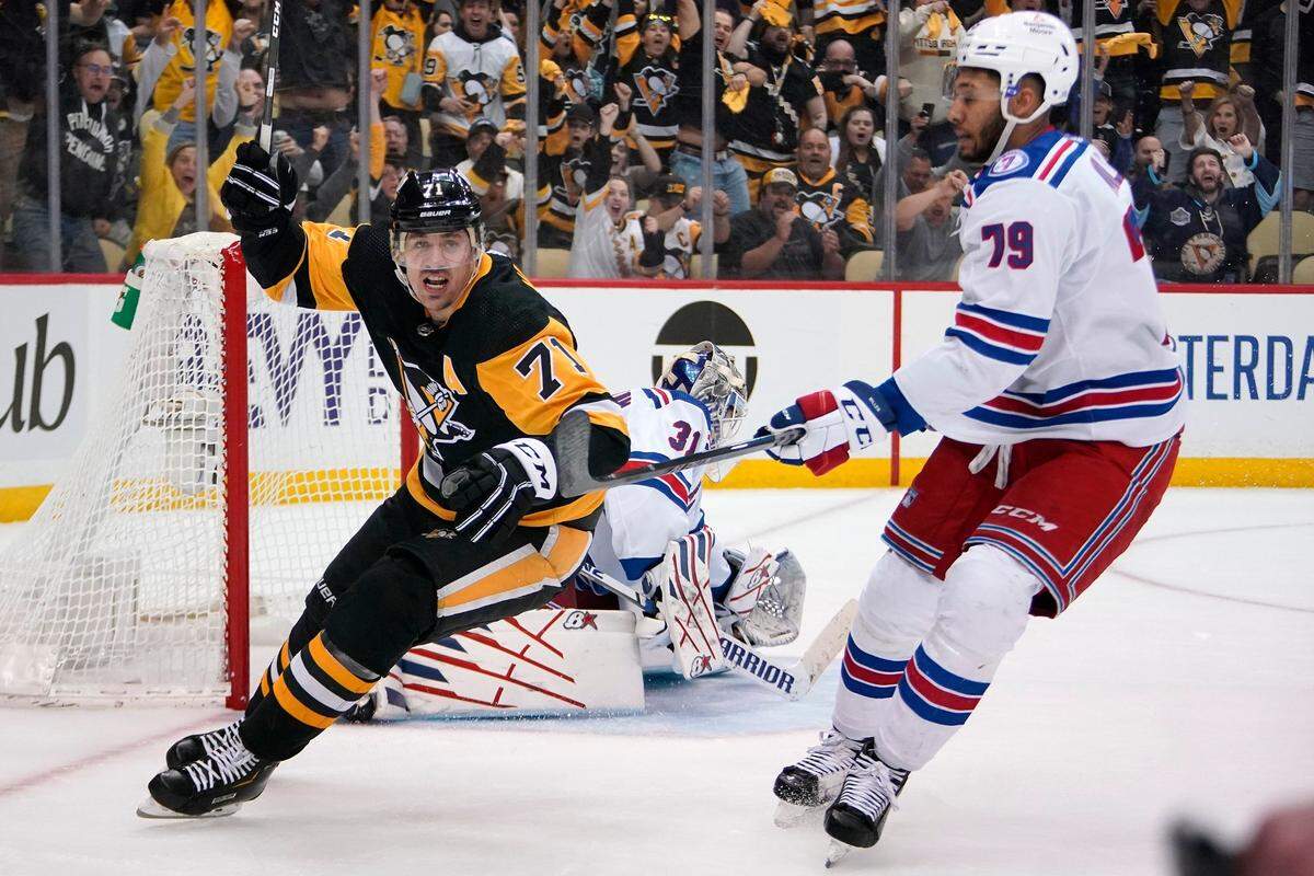 FILE - Pittsburgh Penguins’ Evgeni Malkin (71) celebrates after his goal during the second period in Game 6 of an NHL hockey Stanley Cup first-round playoff series against the New York Rangers in Pittsburgh, May 13, 2022. Malkin has decided to go to free agency rather than re-sign with the Penguins before the start of free agency, a person with knowledge of the move said. The person spoke to the The Associated Press on condition of anonymity because neither Malkin nor the Penguins announced the intent for him to go to market. (AP Photo/Gene J. Puskar, File)