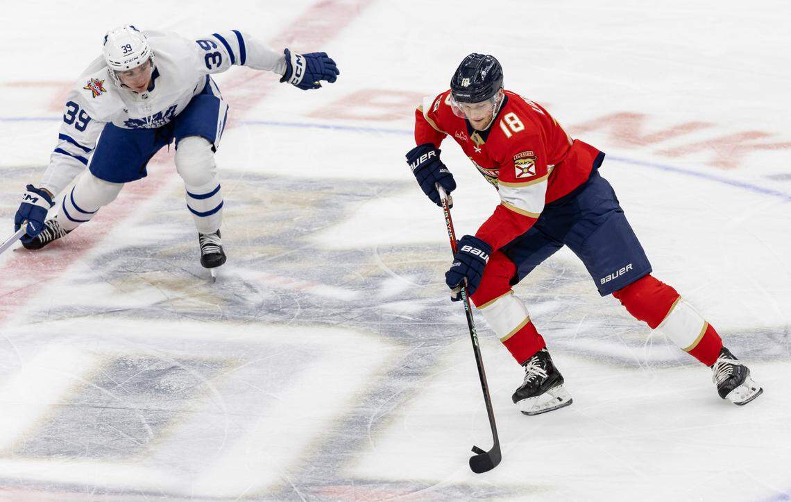 Florida Panthers center Steven Lorentz (18) skates with the puck as Toronto Maple Leafs center Fraser Minten (39) defends in the third period of their NHL game at the Amerant Bank Arena on Thursday, Oct. 19, 2023, in Sunrise, Fla.