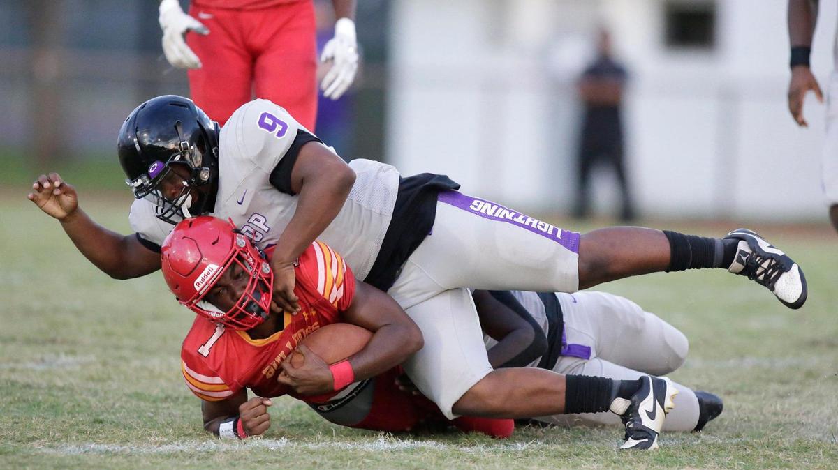 Dr. Krop Lightning linebacker Nathan Adras (9) tackles South Broward Bulldogs running back Chris Humphrey (1) during the football game on Friday, September 22, 2023 at South Broward HS in Hollywood.
