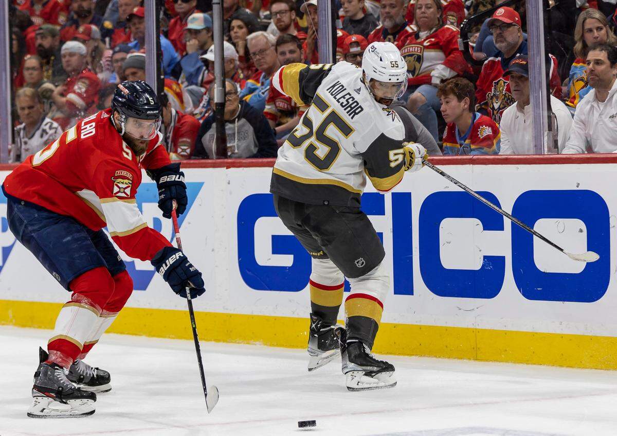 Florida Panthers defenseman Aaron Ekblad (5) and Vegas Golden Knights right wing Keegan Kolesar (55) compete for the puck in the second period of Game 4 of the NHL Stanley Cup Final at the FLA Live Arena on Saturday, June 10, 2023, in Sunrise, Fla.