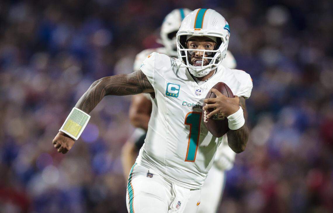 Miami Dolphins quarterback Tua Tagovailoa (1) scrambles in the game against the Buffalo Bills in the second quarter of their NFL football game at Highmark Stadium in Orchard Park, NY, on Thursday, September 18, 2025.