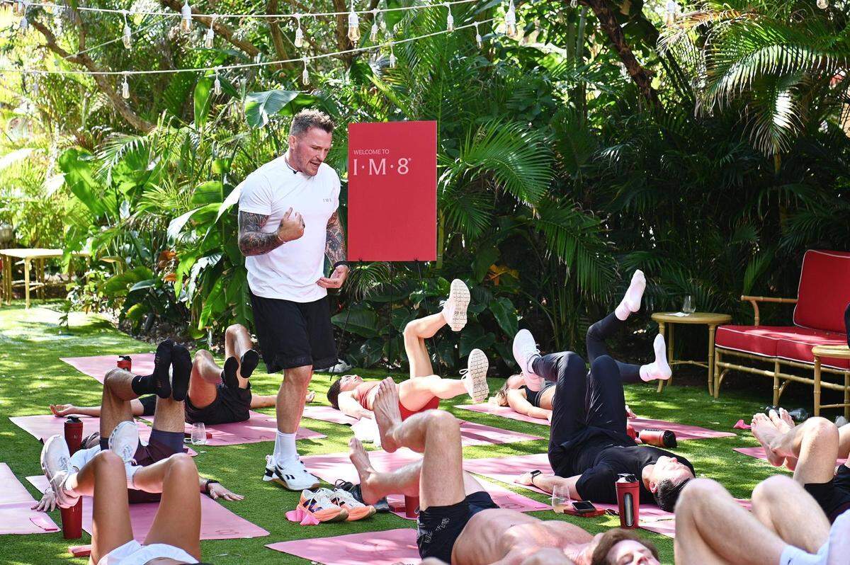 Bobby Rich, personal trainer to David and Victoria Beckham, leads an outdoor fitness class in the Mammoth Garden at the Faena Hotel Miami Beach on Monday, April 7, 2025 for IM8 ambassadors and select VIP TikTok and Meta creators. The class was part of an event showcasing Beckham’s IM8 supplement.