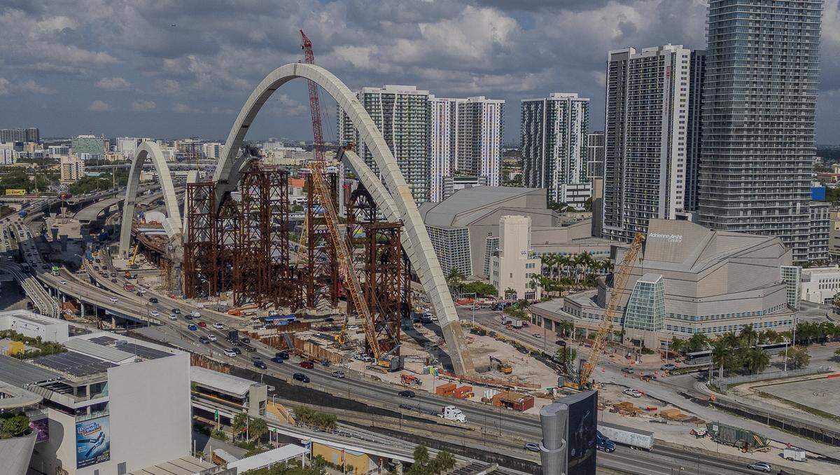 View of the ongoing construction of the arches for the I-395 signature bridge as part of the I-395/I-95 Design-Build Project, in front of the Adrienne Arsht Center, in downtown Miami, on Thursday, March 26, 2026.
