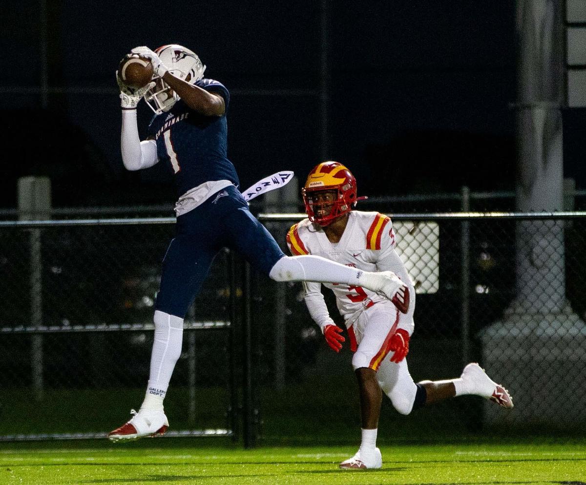 Chaminade wide receiver Joshisa Trader (1) catches a pass from his quarterback Cedrick Bailey (11). The Chaminade Lions lead the Clearwater Central Catholic Marauders 28-0 at the half of the Class IM State Championship game at Gene Cox Stadium in Tallahassee, Florida on Thursday, Dec. 8, 2022.