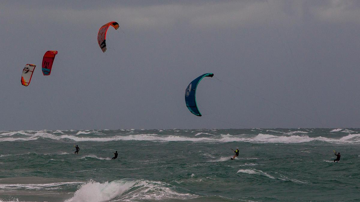 Kite surfers ride the waves off Jupiter Beach in 2019.