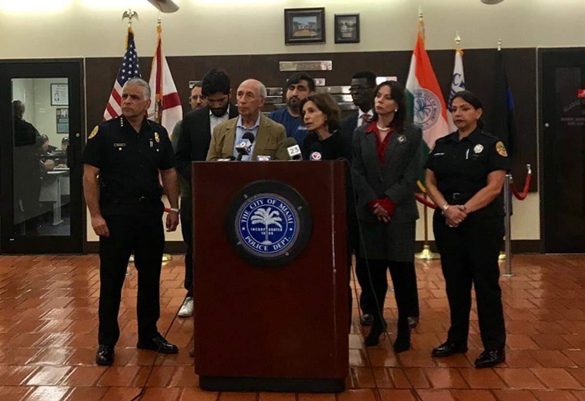 Uliese Vizcardo, left, and Raizha Chiesi stand at the podium asking for the public’s help in finding their son Gonzalo Vizcardo’s killer at a press conference in Miami on Tuesday, December 3, 2019. Vizcardo was fatally shot just after 1 a.m. on Nov. 7. in the area of Northeast Miami Place and 55th Street.